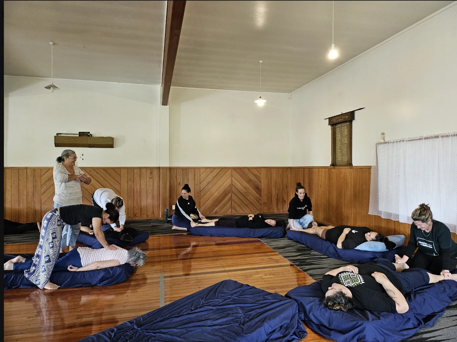 Te Kahu Wahine workshop in Te Taitokerau, with participants practising together on floor mats